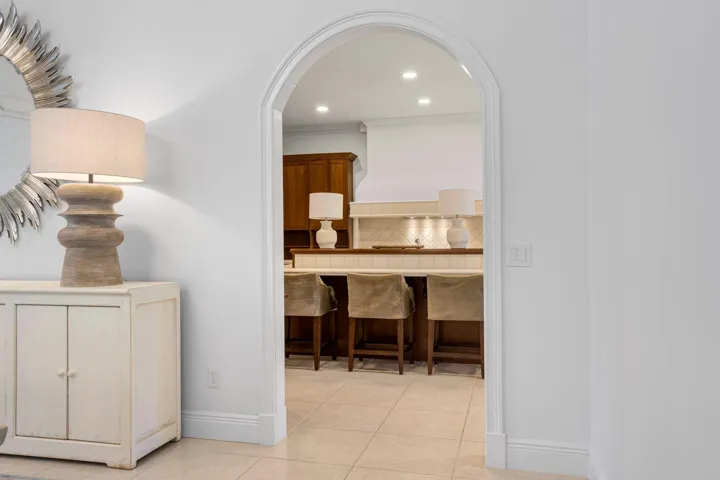 ARCHED ENTRY OFFERS A WELCOMING TRANSITION INTO THE KITCHEN