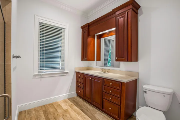 PRIMARY SUITE FEATURING SEPARATE HIS AND HER BATH AREAS WITH GENEROUS WALK IN CLOSET SPACE