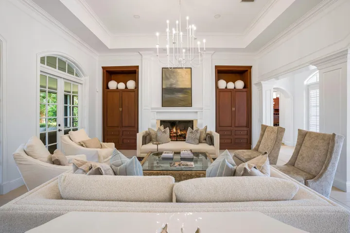 ELEGANT GREAT ROOM WITH SOARING CEILINGS, CUSTOM BUILT-INS AND FIREPLACE