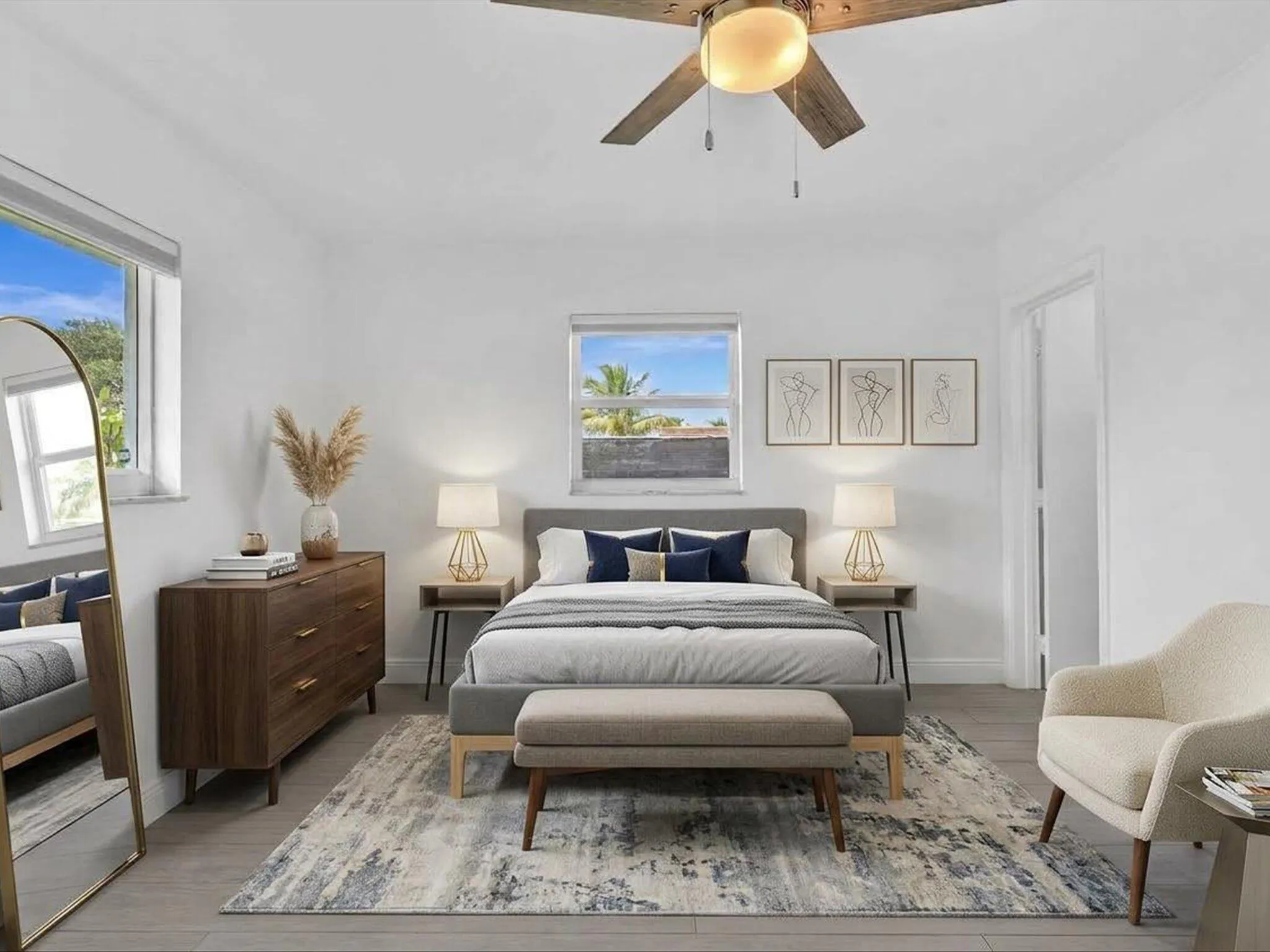 VIRTUALLY STAGED. Bedroom with wood-finish ceiling fan with integrated lighting, and light grey vinyl flooring