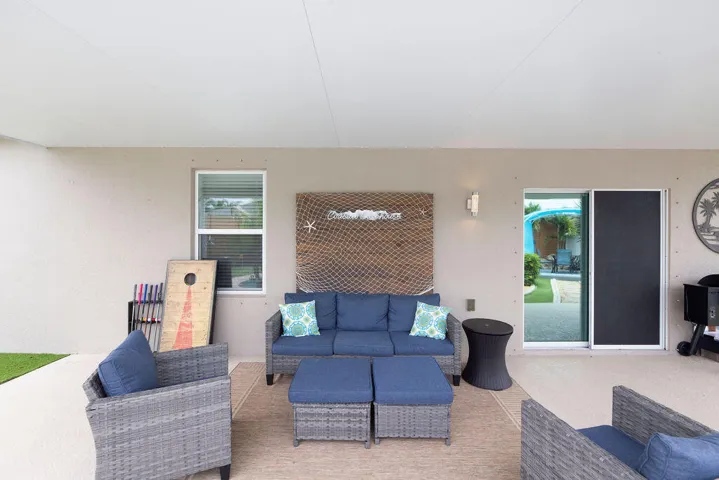 Covered patio with outdoor sectional seating off the living area