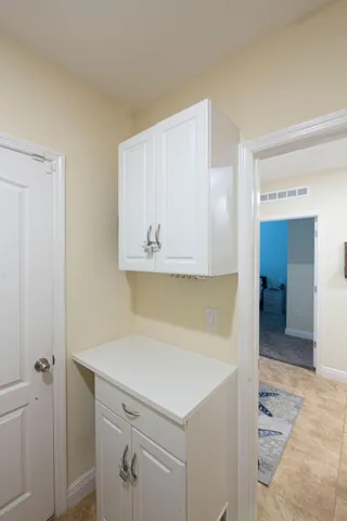 Laundry area with cabinetry and counter space