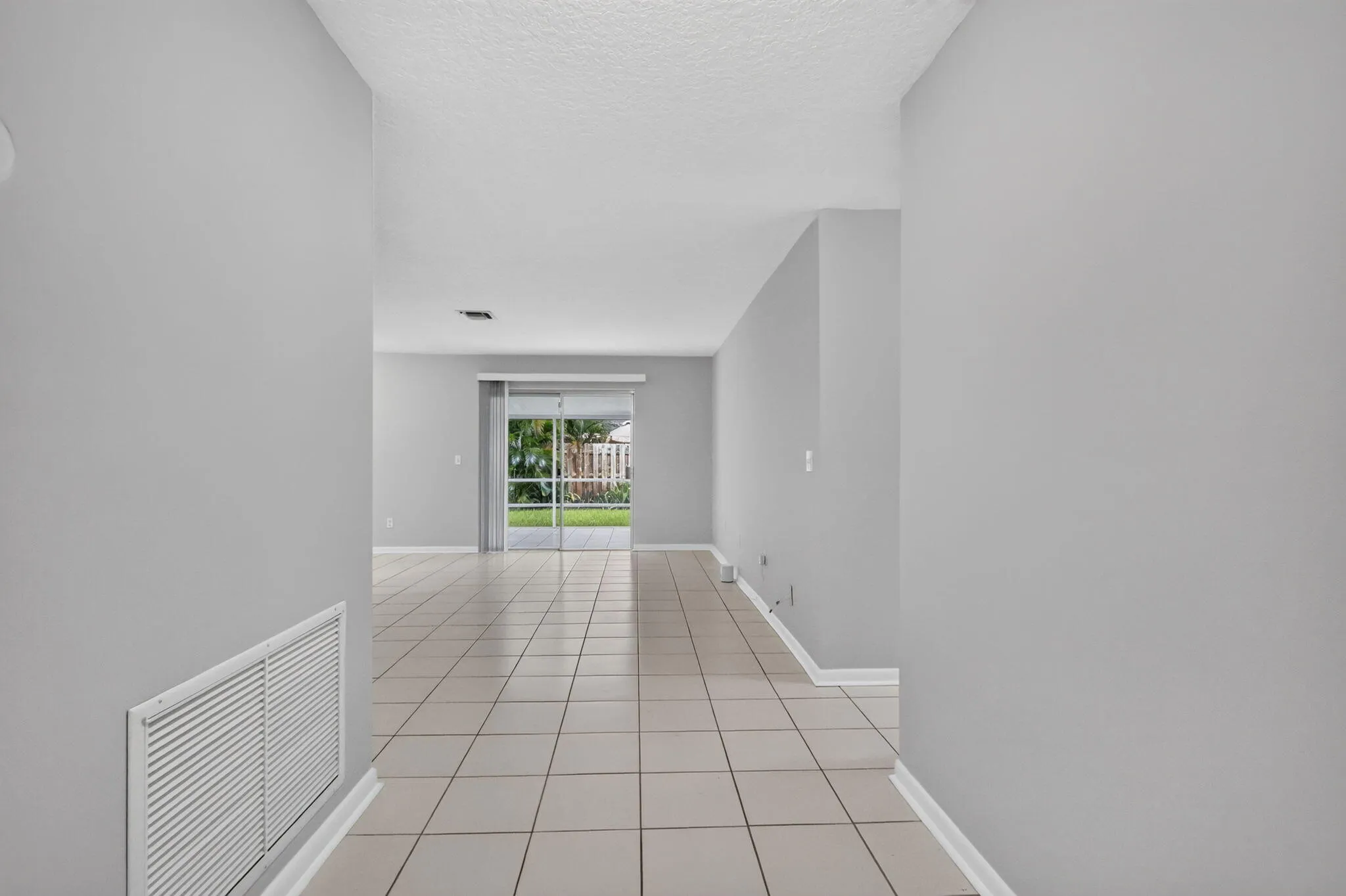 Light grey wall paint with ceramic tile flooring