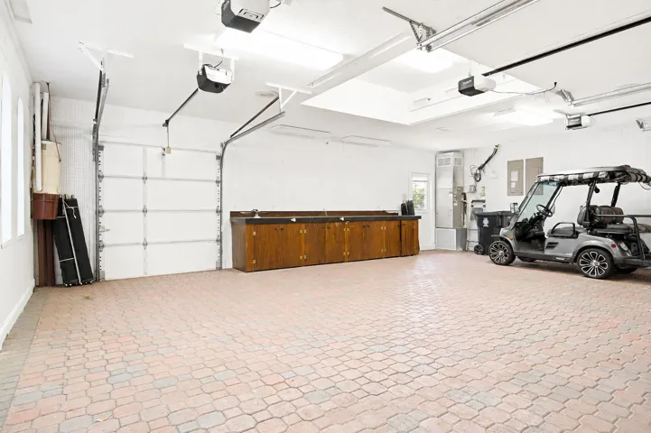 garage with golf cart garage door