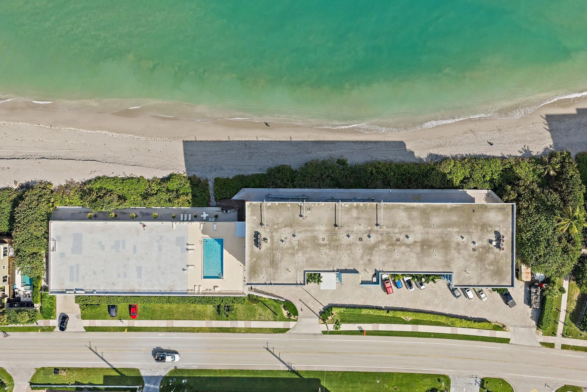 Coastal property with direct beach frontage, private swimming pool, and dedicated parking