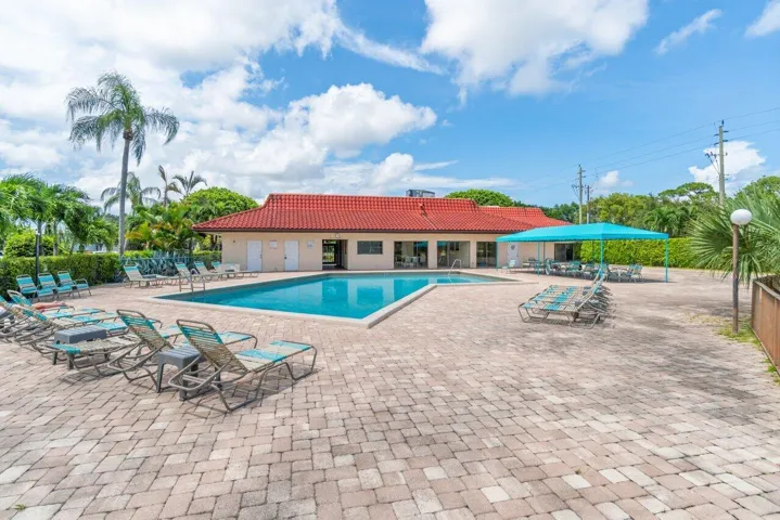 Community pool and recreation area located beside the clubhouse.