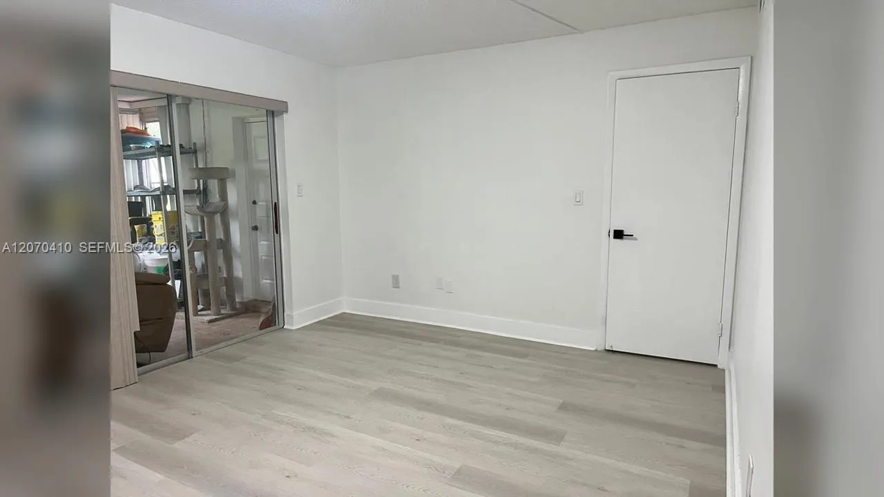 Primary Bedroom, Sliding Glass Door to Enclosed Porch