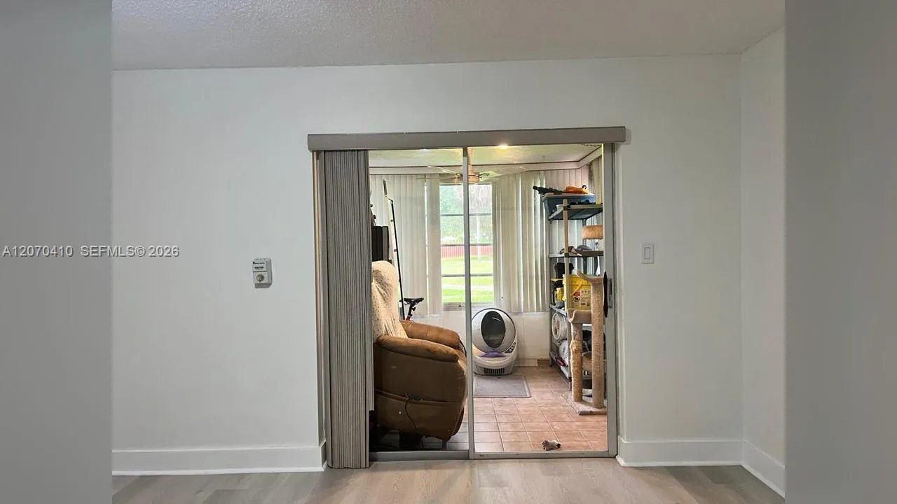 Primary Bedroom, Sliding Glass Door to Enclosed Porch