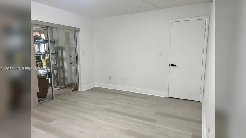 Primary Bedroom, Sliding Glass Door to Enclosed Porch