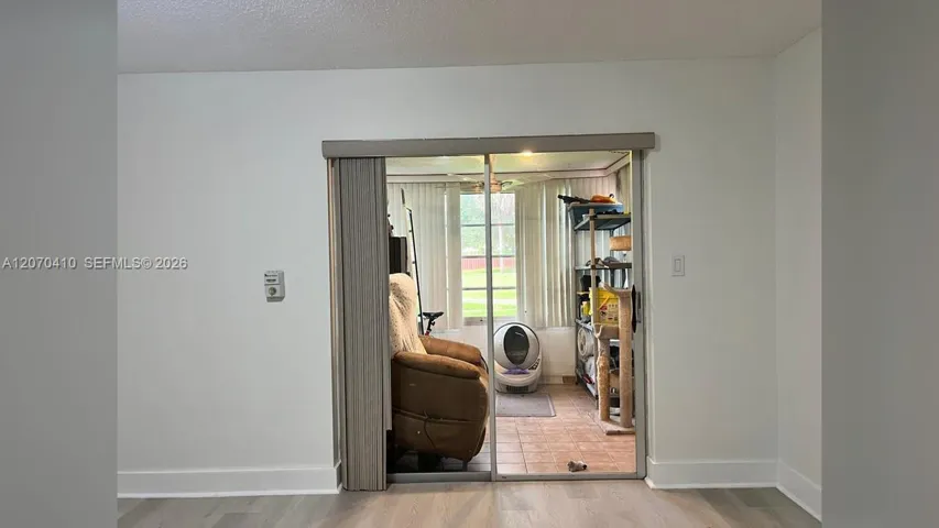 Primary Bedroom, Sliding Glass Door to Enclosed Porch