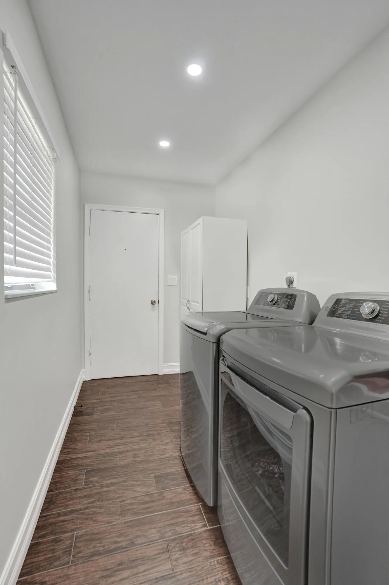 laundry room adjacent garage and flex space