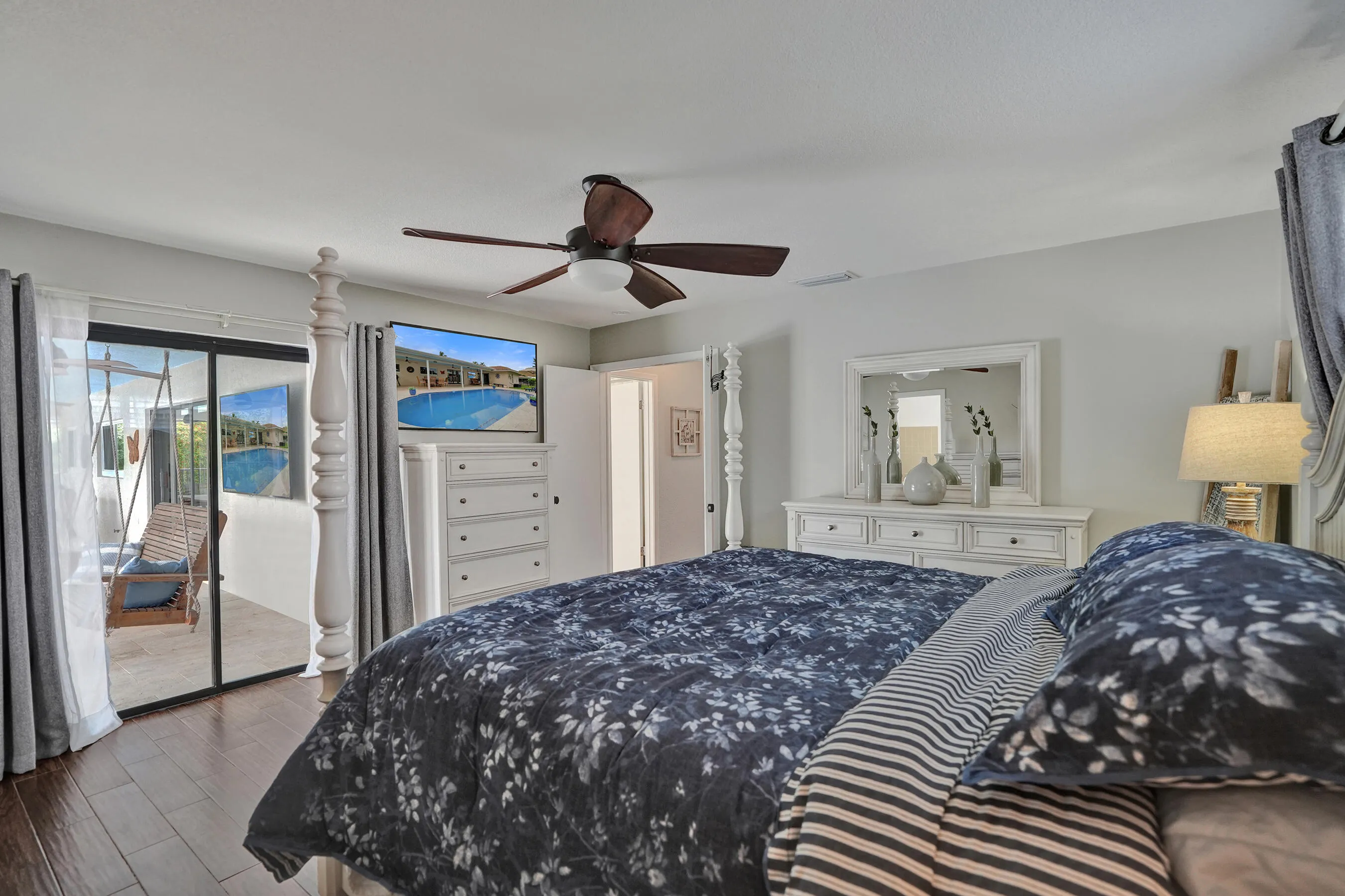 Primary bedroom leads out to pool area