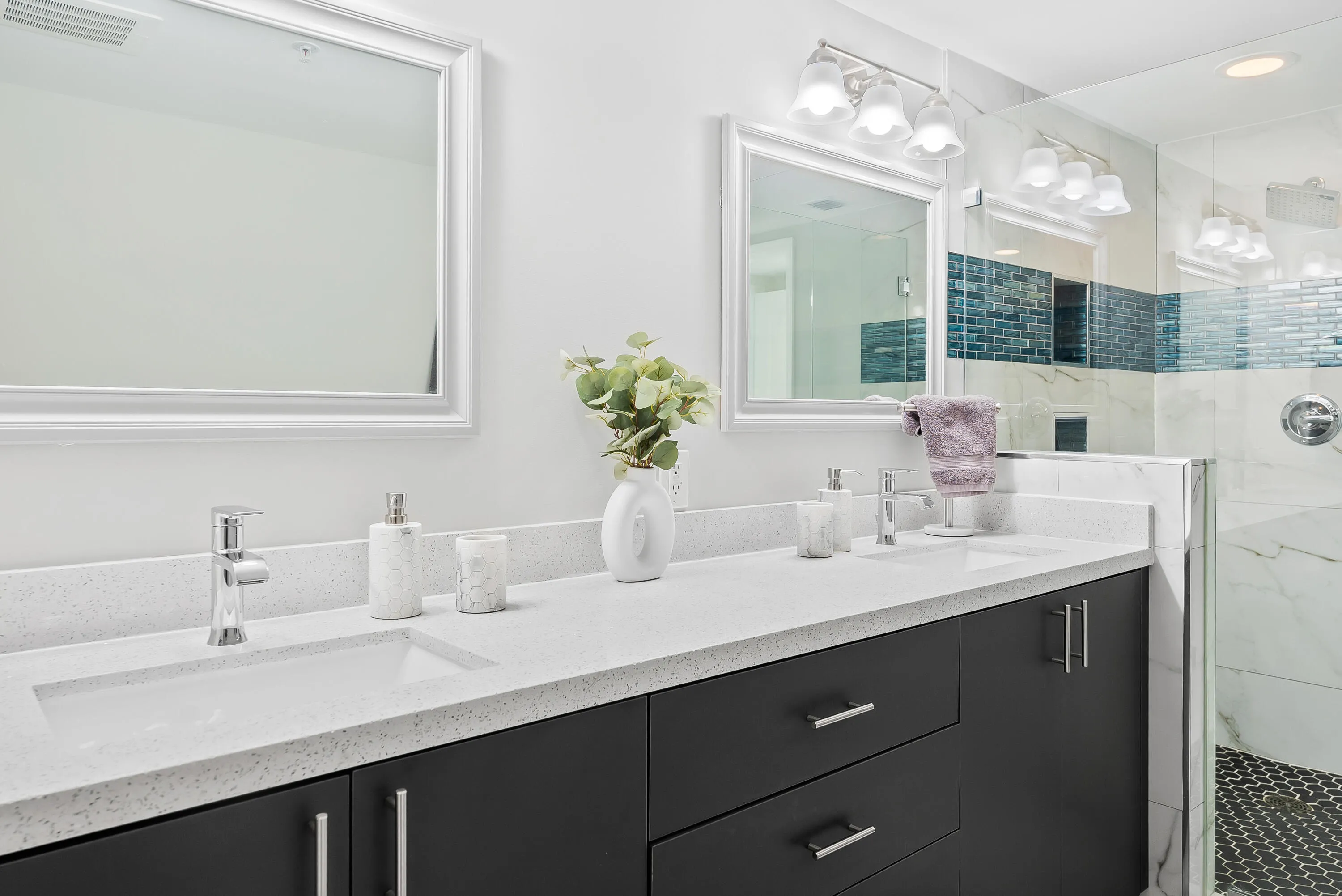 Remodeled primary bathroom with shower, dual sinks & freestanding bathtub