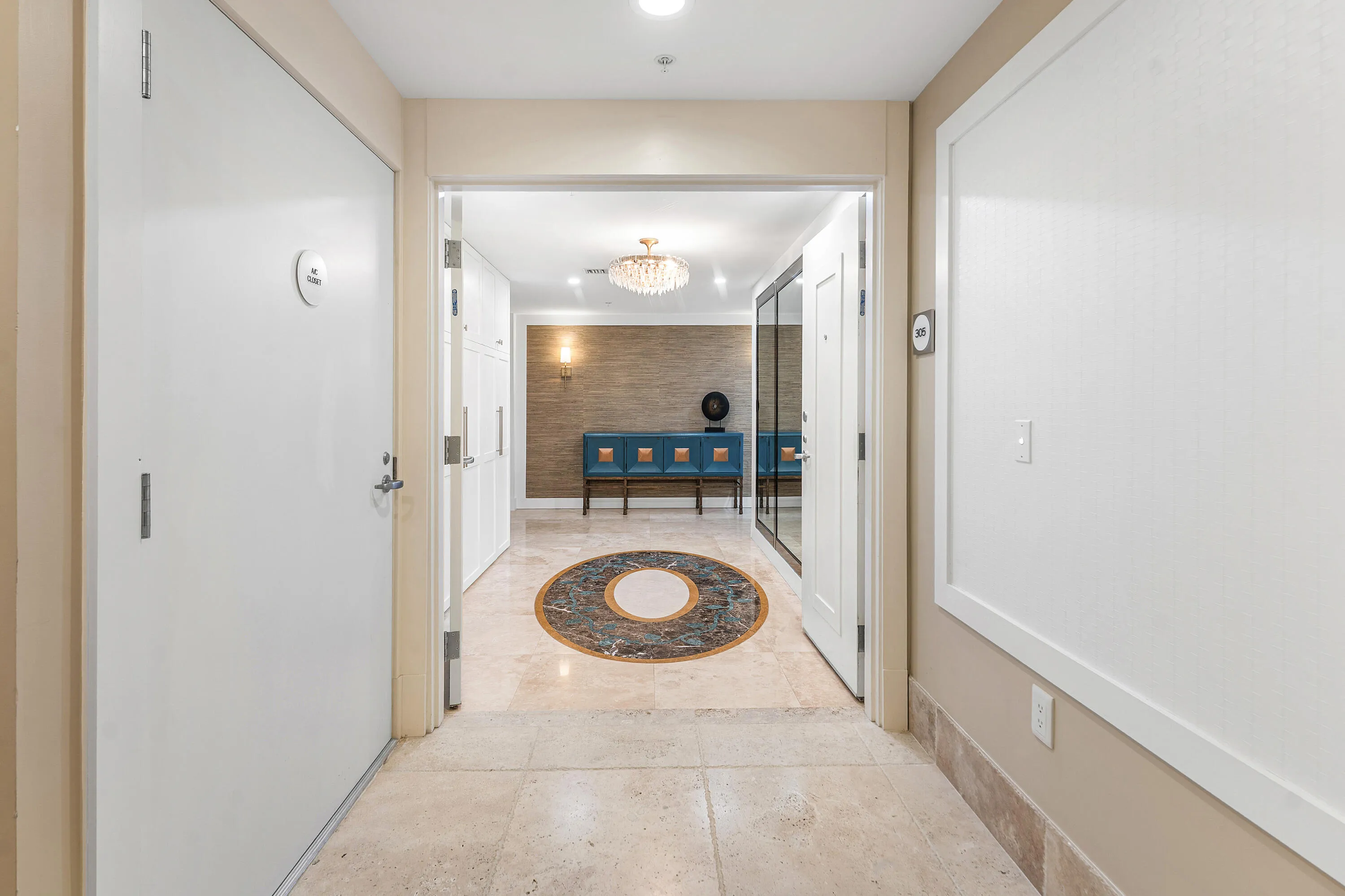 Double entryway makes an open and dramatic entrance to the home