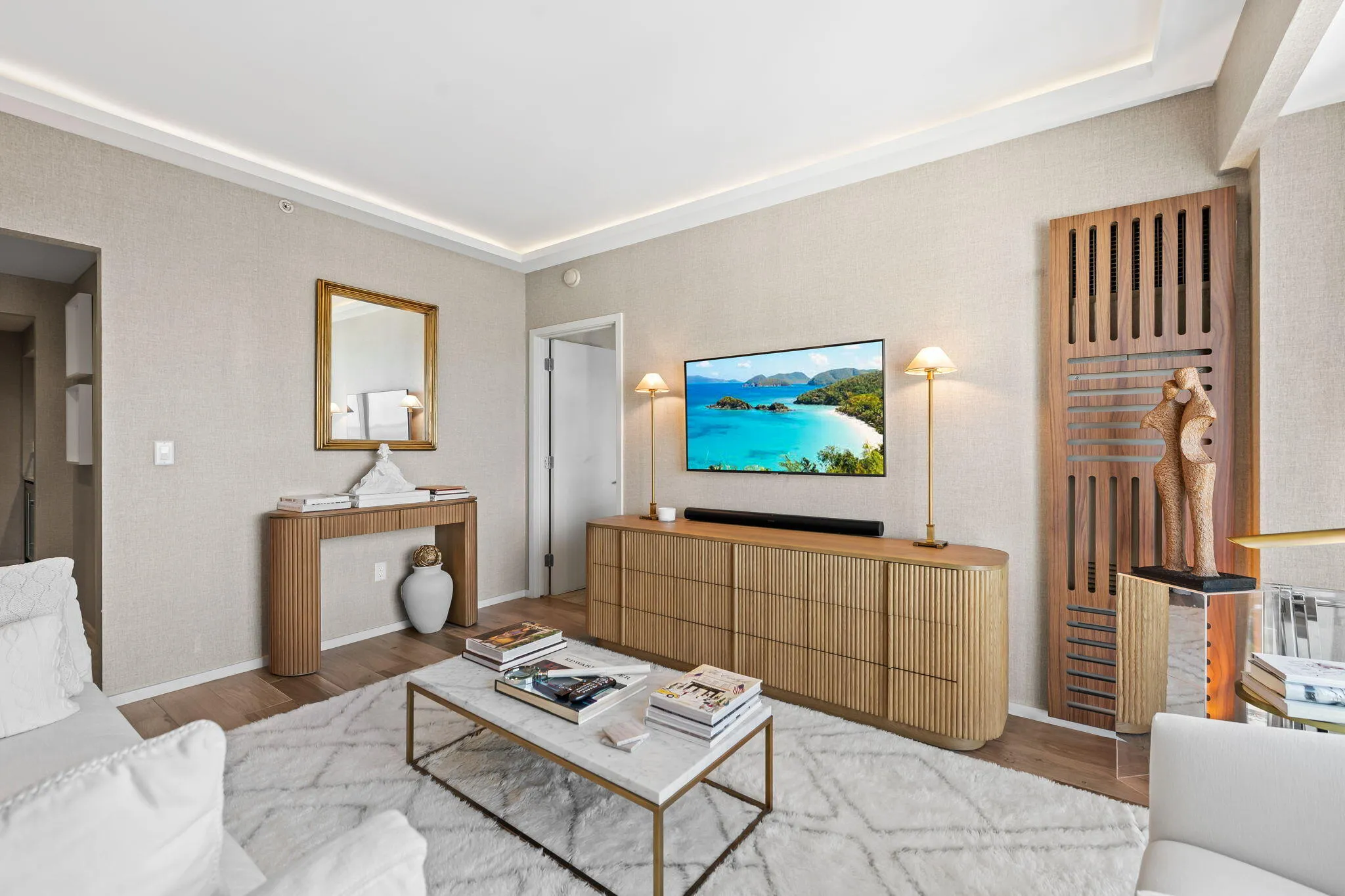 Recessed perimeter lighting, wood-finish flooring, and crown molding