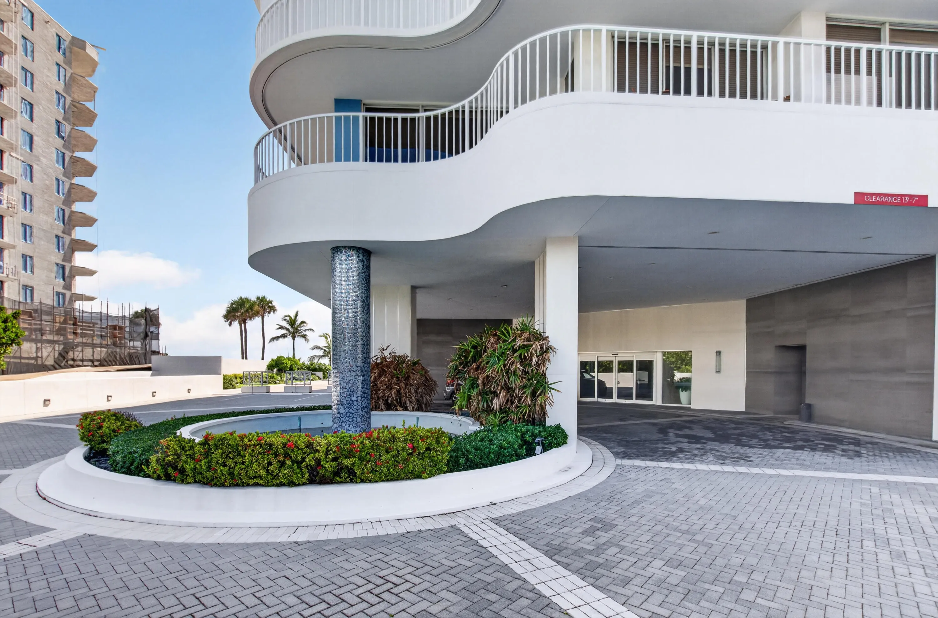 Circular paver driveway with integrated landscaping