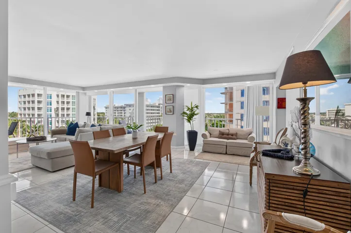 Expansive living area with large format tile flooring and a neutral color palette