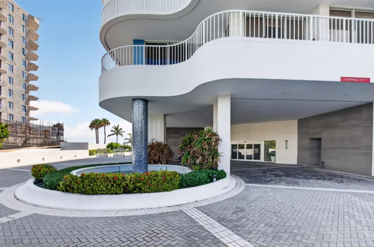 Circular paver driveway with integrated landscaping
