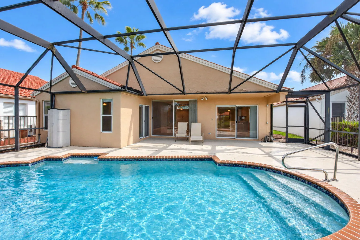 Private Screened Enclosed Lanai with cool deck & in-ground pool