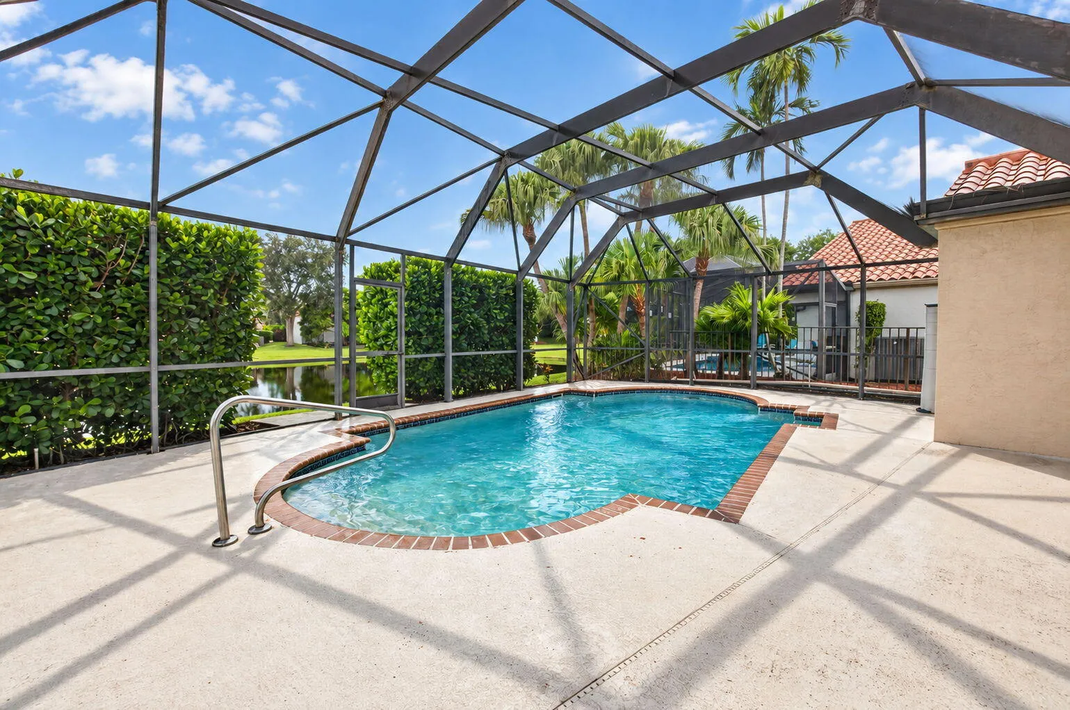 Private Screened Enclosed Lanai with cool deck & in-ground pool