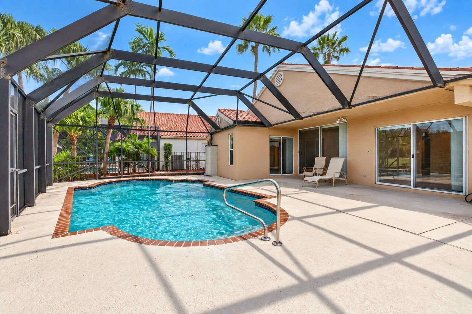 Private Screened Enclosed Lanai with cool deck & in-ground pool