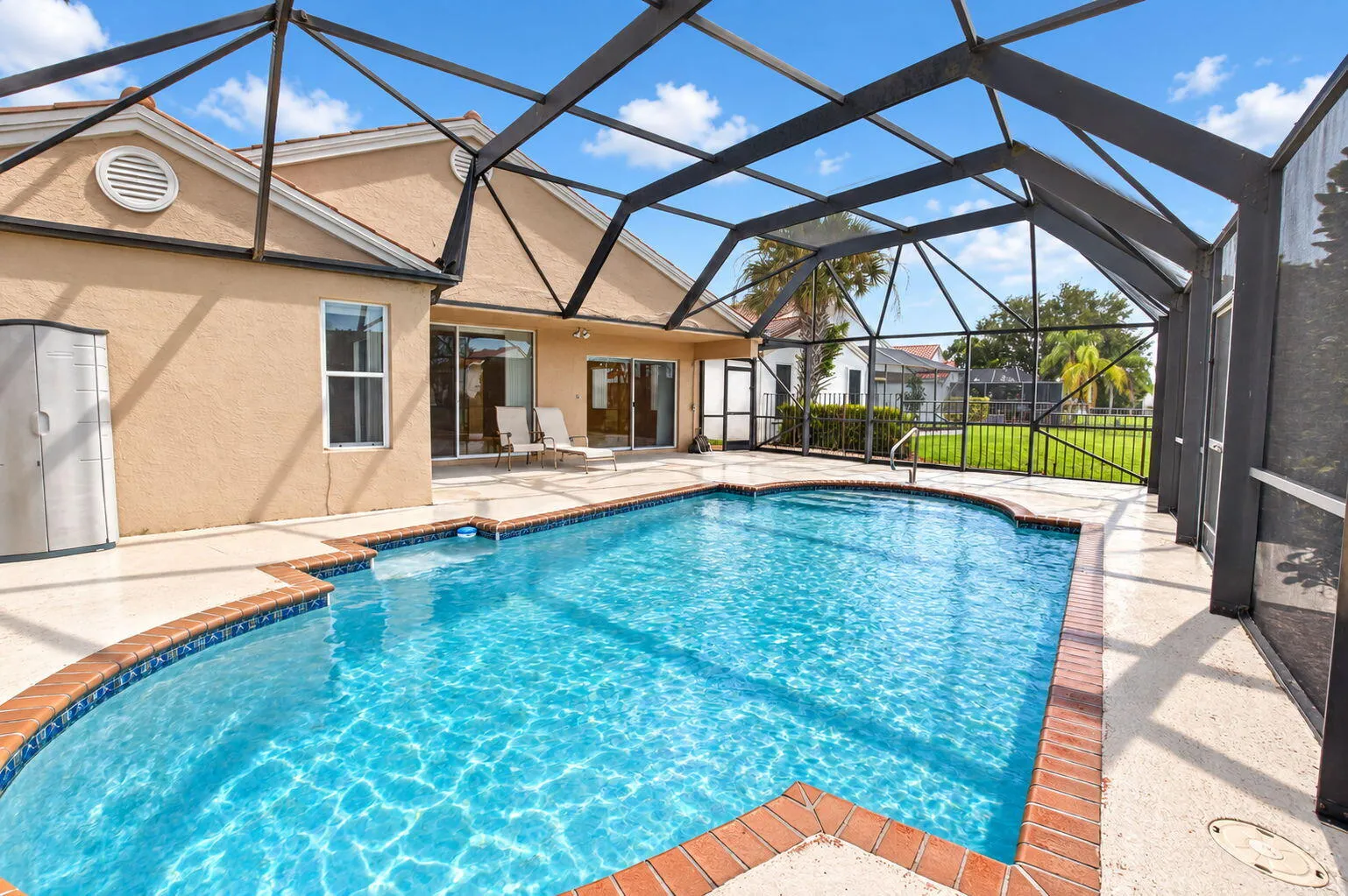 Private Screened Enclosed Lanai with cool deck & in-ground pool