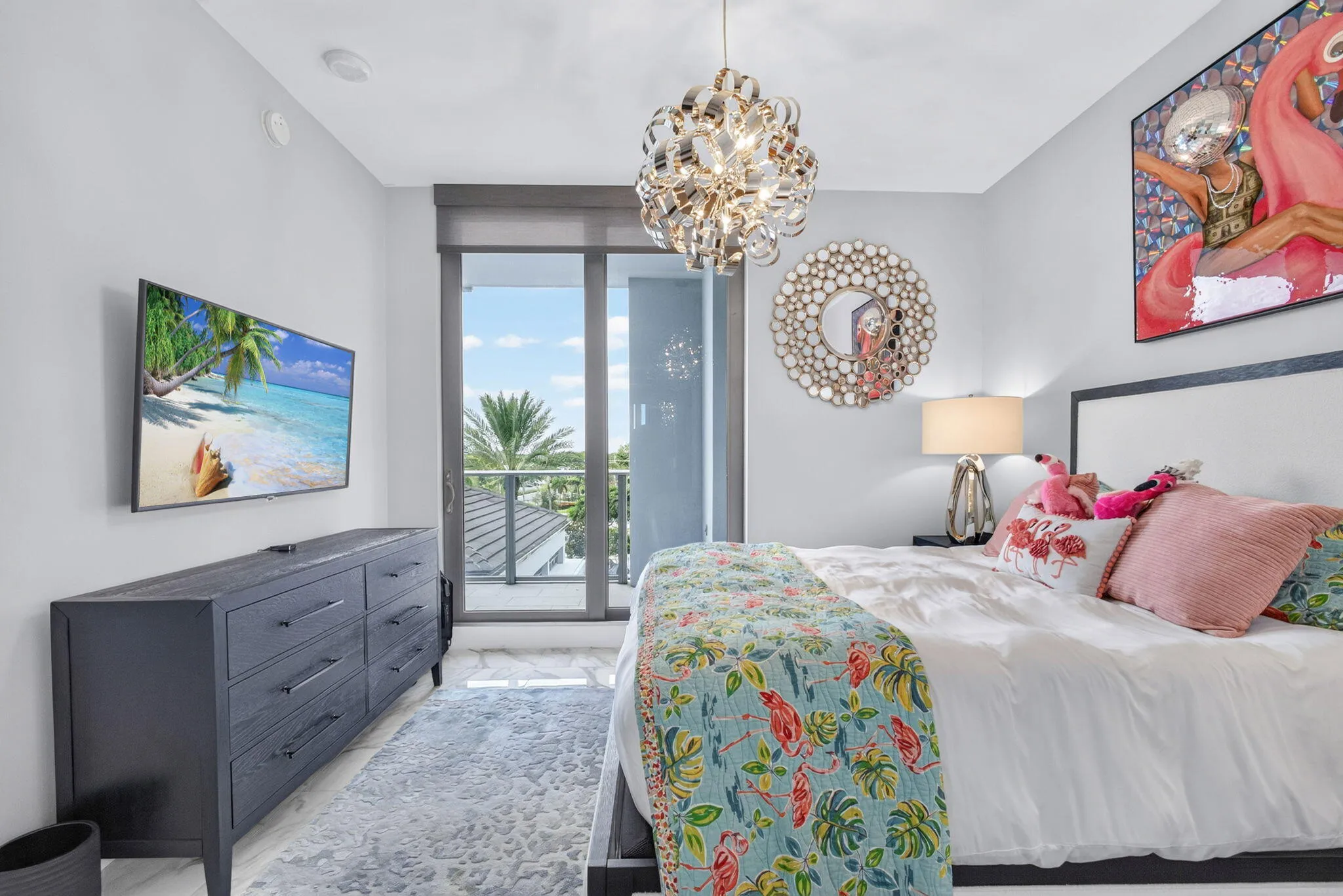 Inviting guest bedroom with sliding glass door, private balcony with an ensuite bathroom and closet.