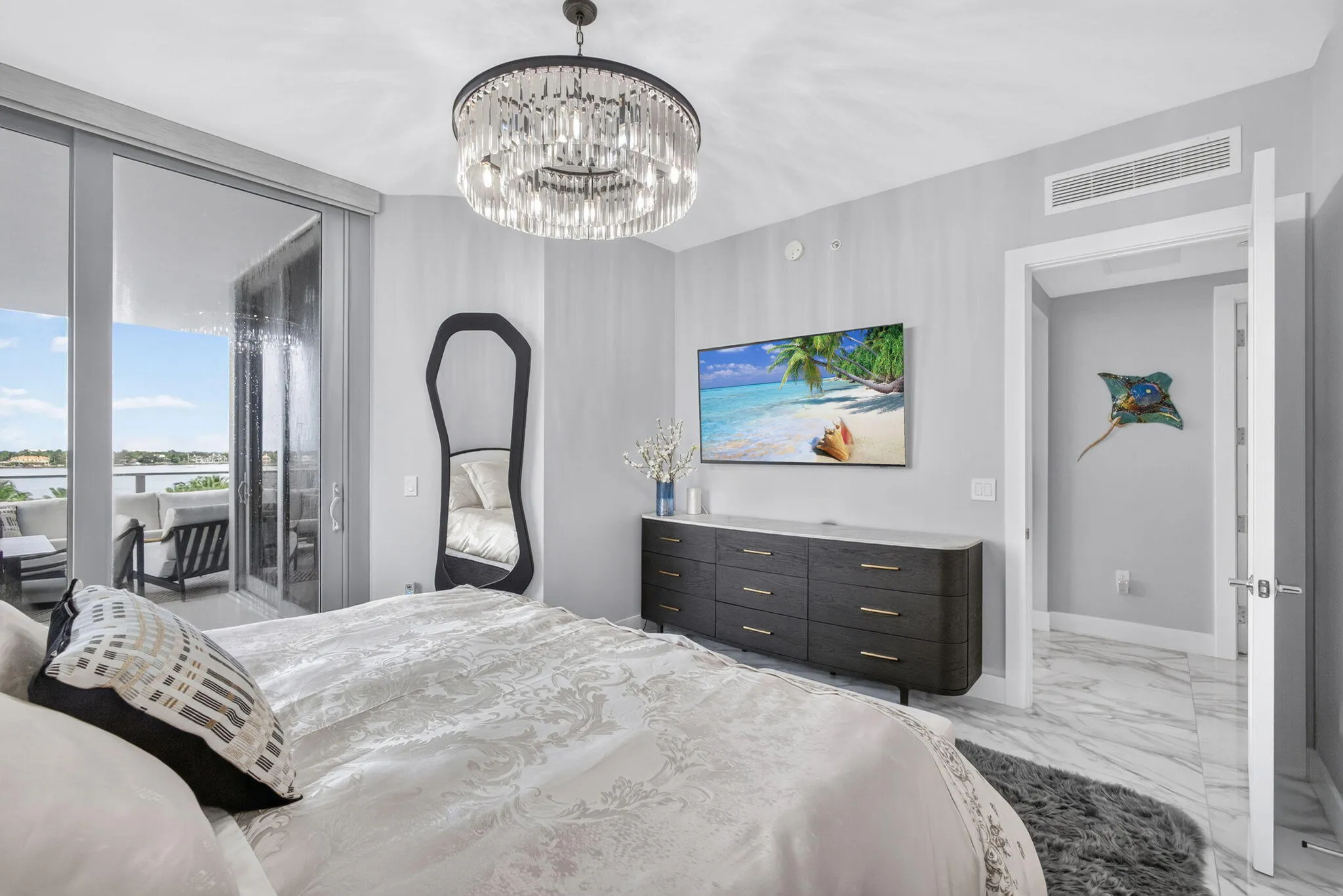 Private Primary Suite has large Sliding glass doors to outdoor balcony, put on your robe and share your morning coffee as the sun rises!