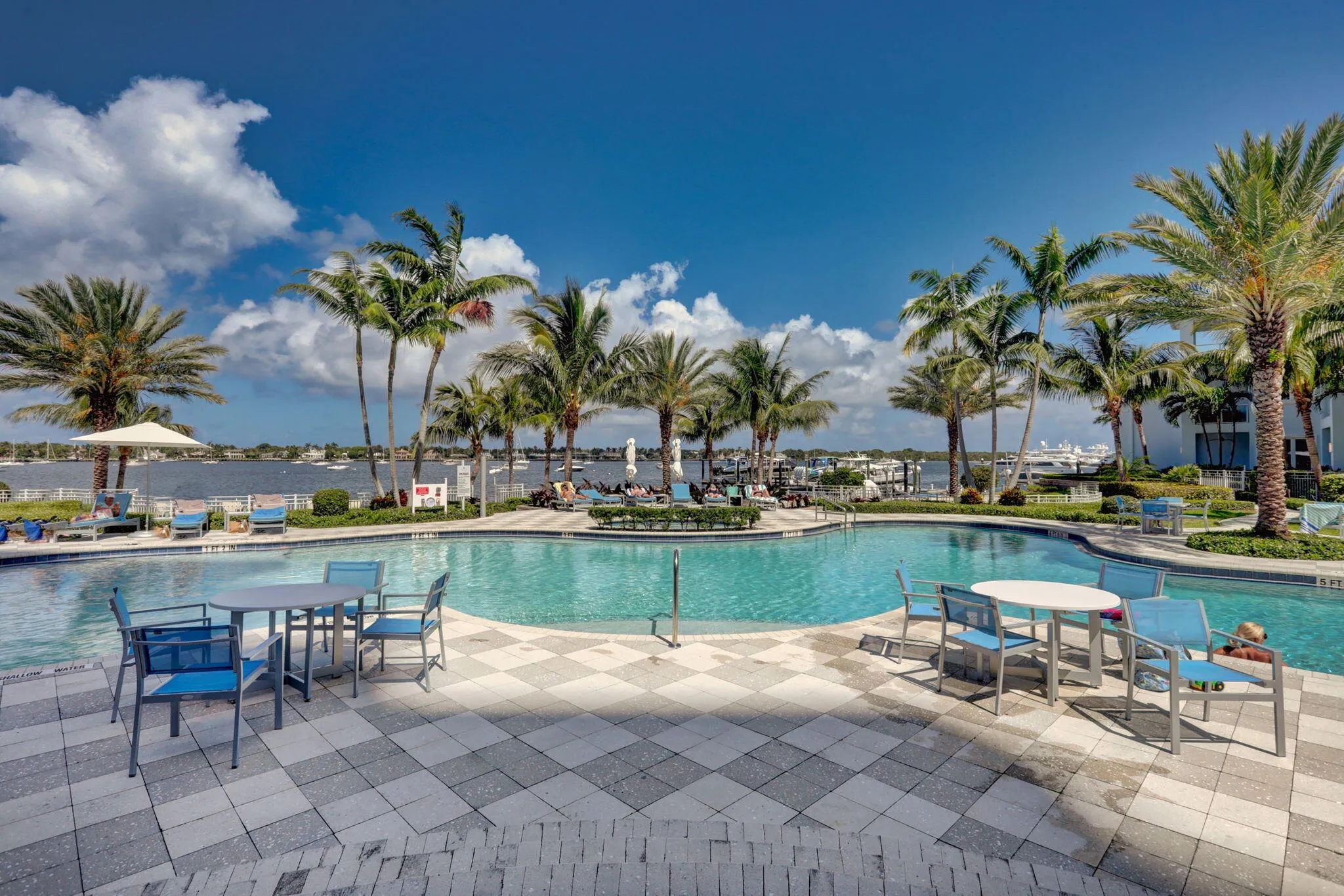 Water Clubs 2nd of 3 Resort-style waterfront pools surrounded by mature palm trees and overlooking the parade of yachts going by...