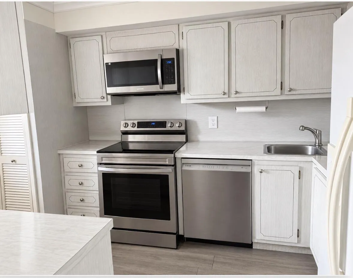spacious kitchen with newer stainless steel appliances