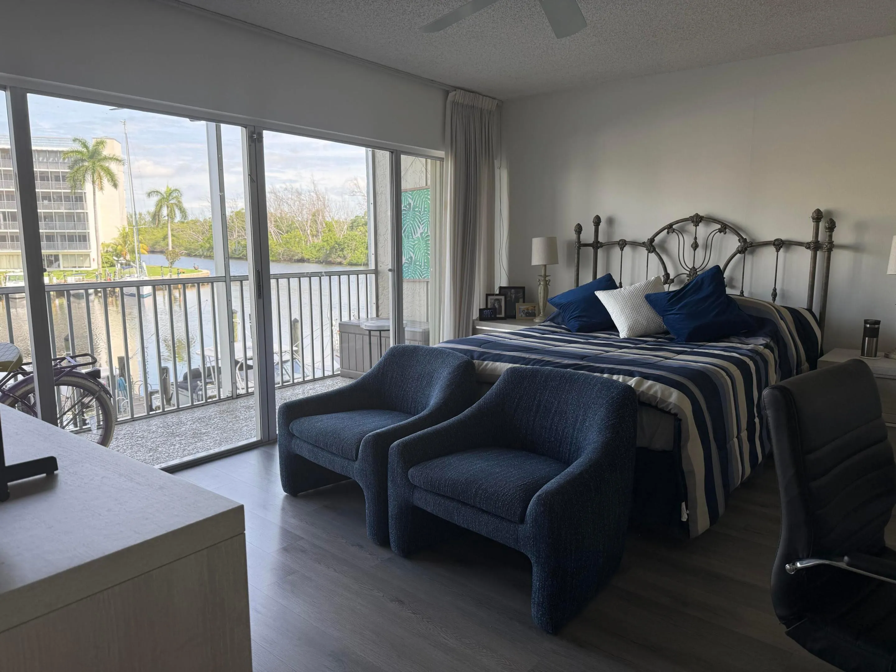 Primary bedroom with a great view, spacious enough for chairs to watch some tv at the foot of the bed