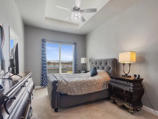 Tray ceiling with a decorative ceiling fan featuring crystal accents