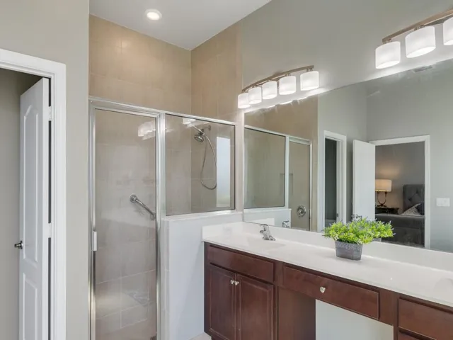 Dual vanity with white countertop and integrated sinks