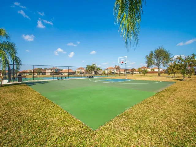 Multi-sport court featuring a basketball hoop and painted lines for various activities