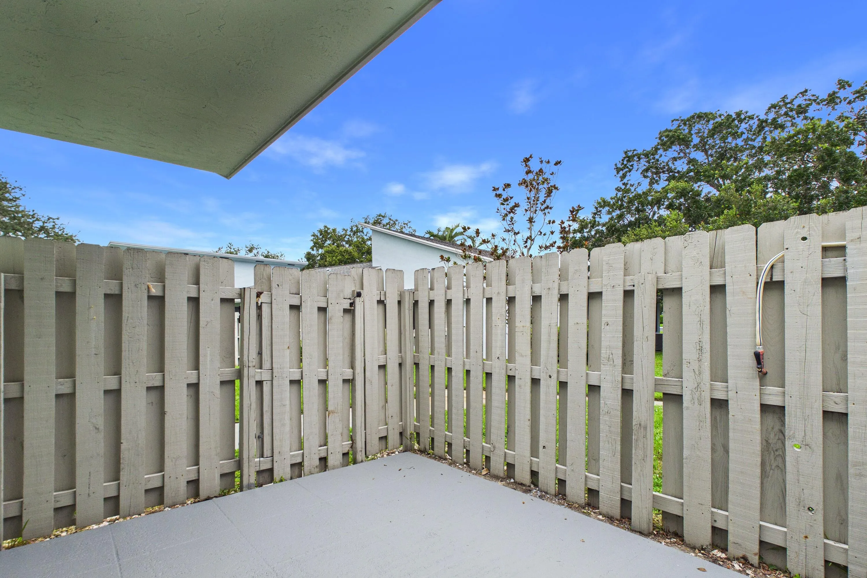 Paved patio with privacy fencing