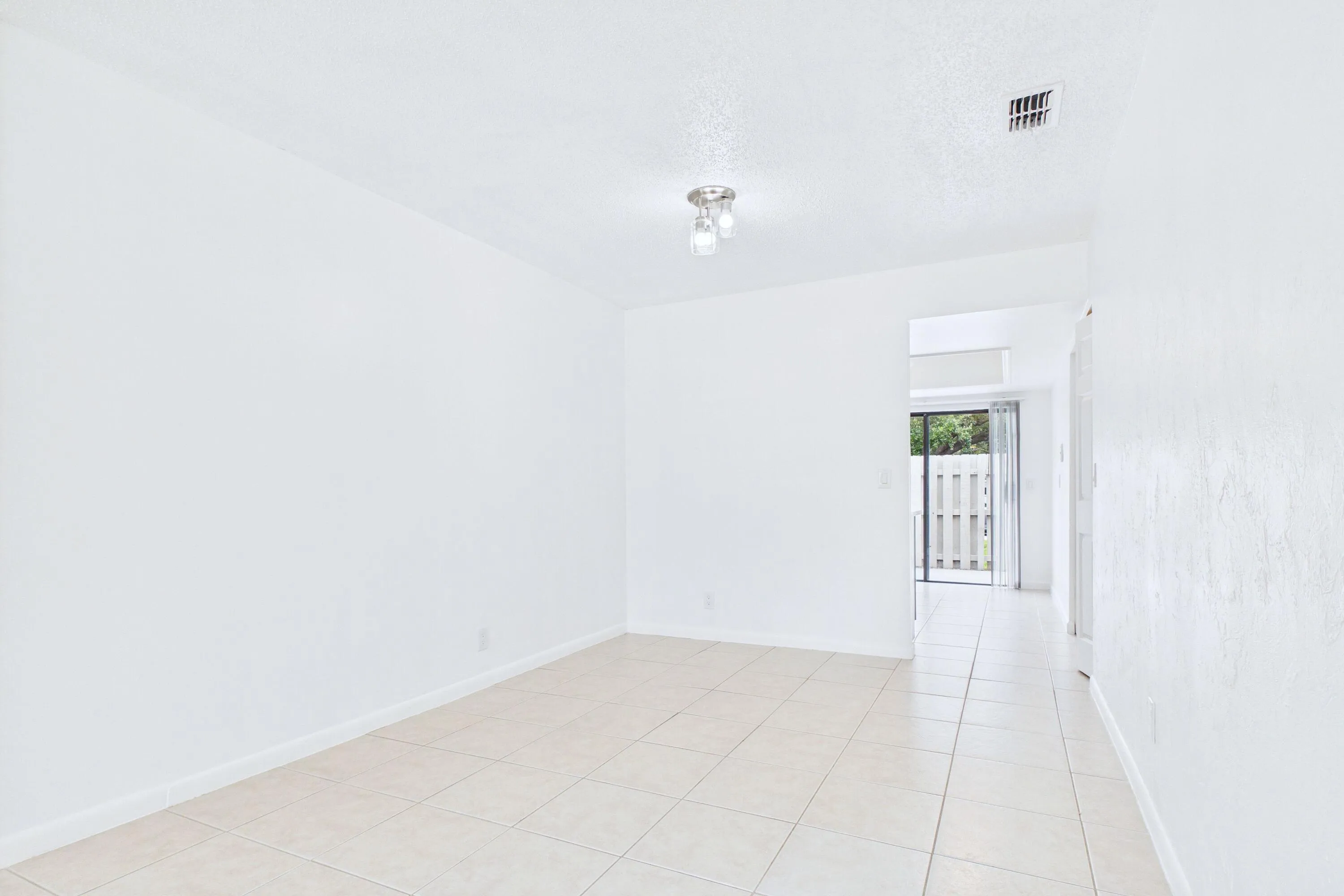 Tile flooring and white walls