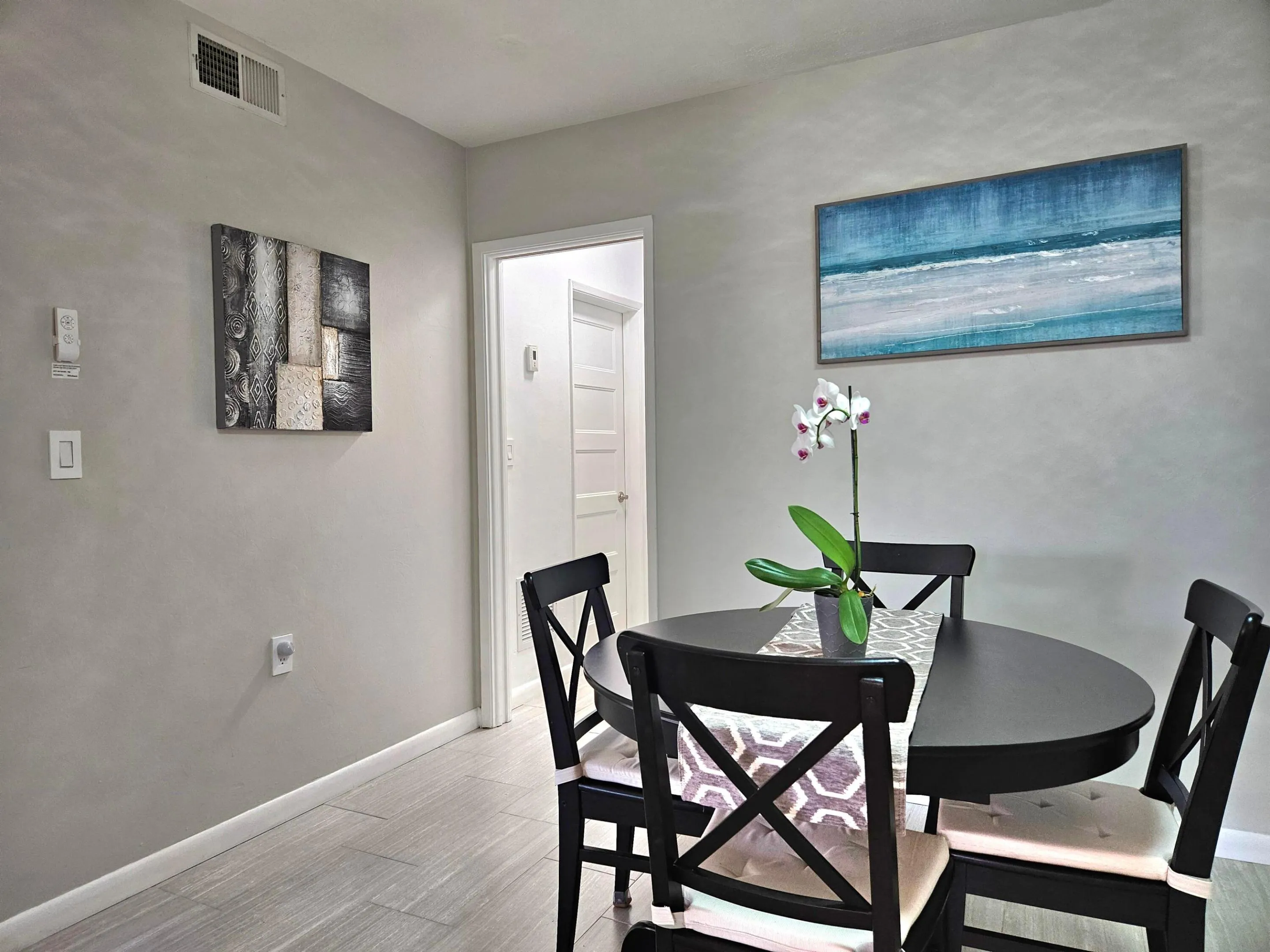 VIEW OF DINING AREA LEADING TO BATHROOM AND BEDROOM