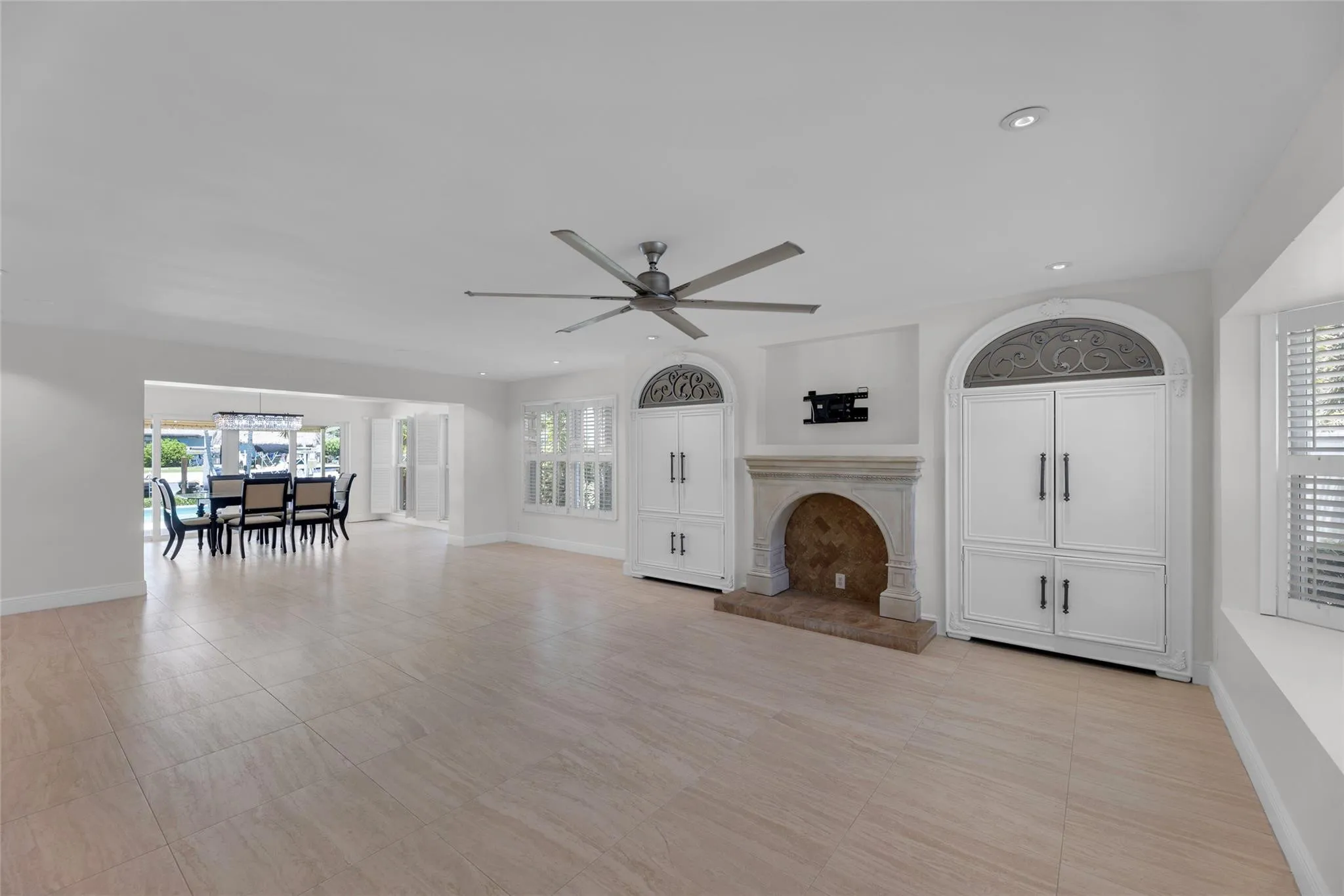Large and spacious living room and dining room with recessed lighting