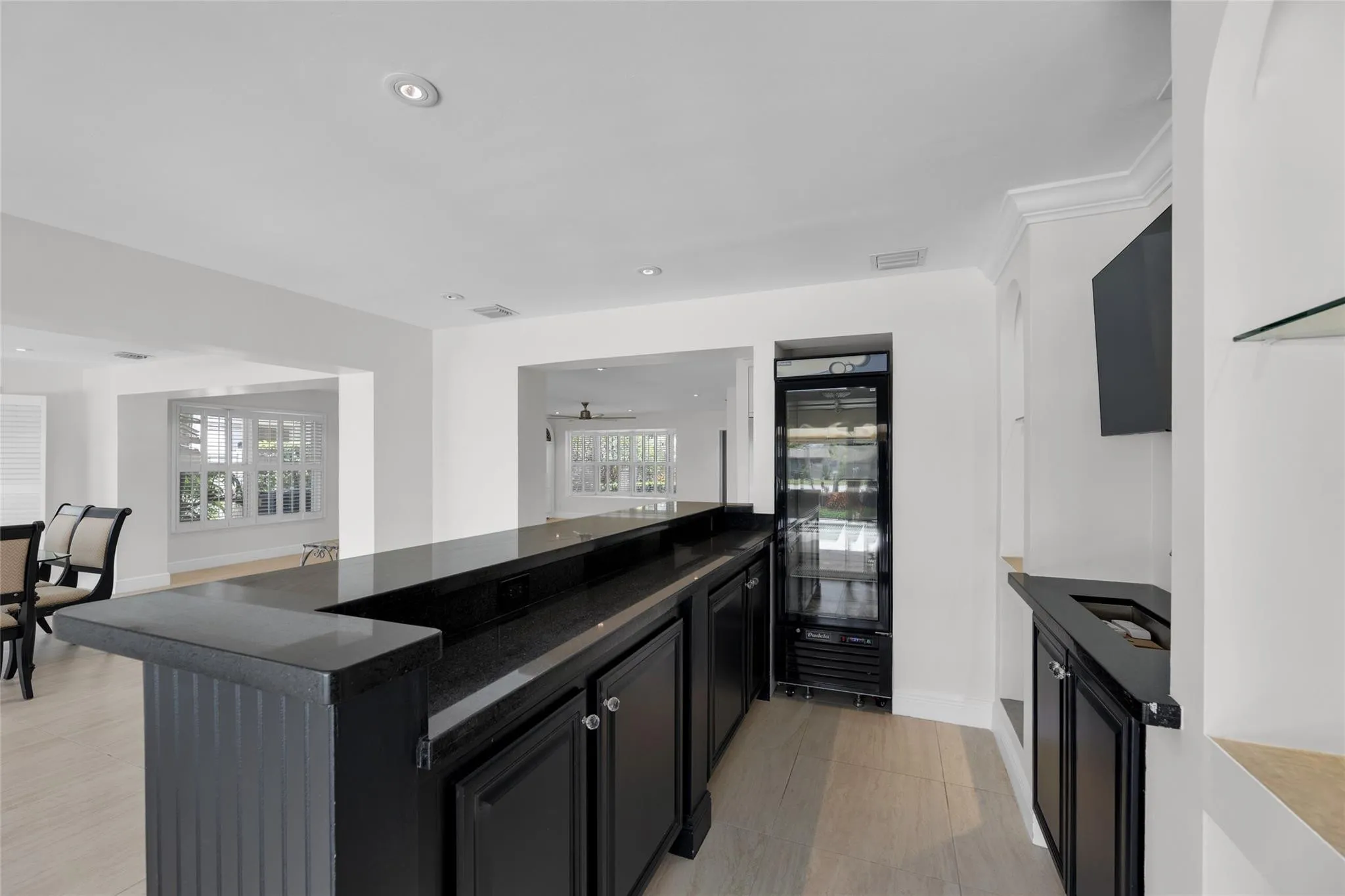 Fabulous wetbar with wine cooler and sink and tons of counter and storage space is perfect for entertaining