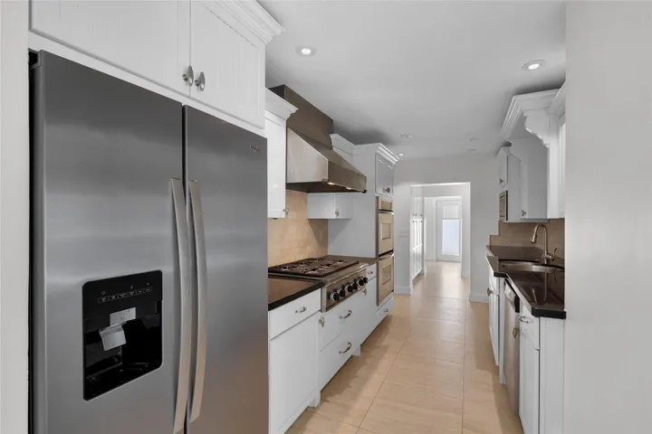 Stainless appliances and tons of storage offered in kitchen