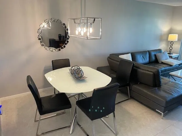 Recessed lighting, tile flooring, and a modern rectangular pendant light