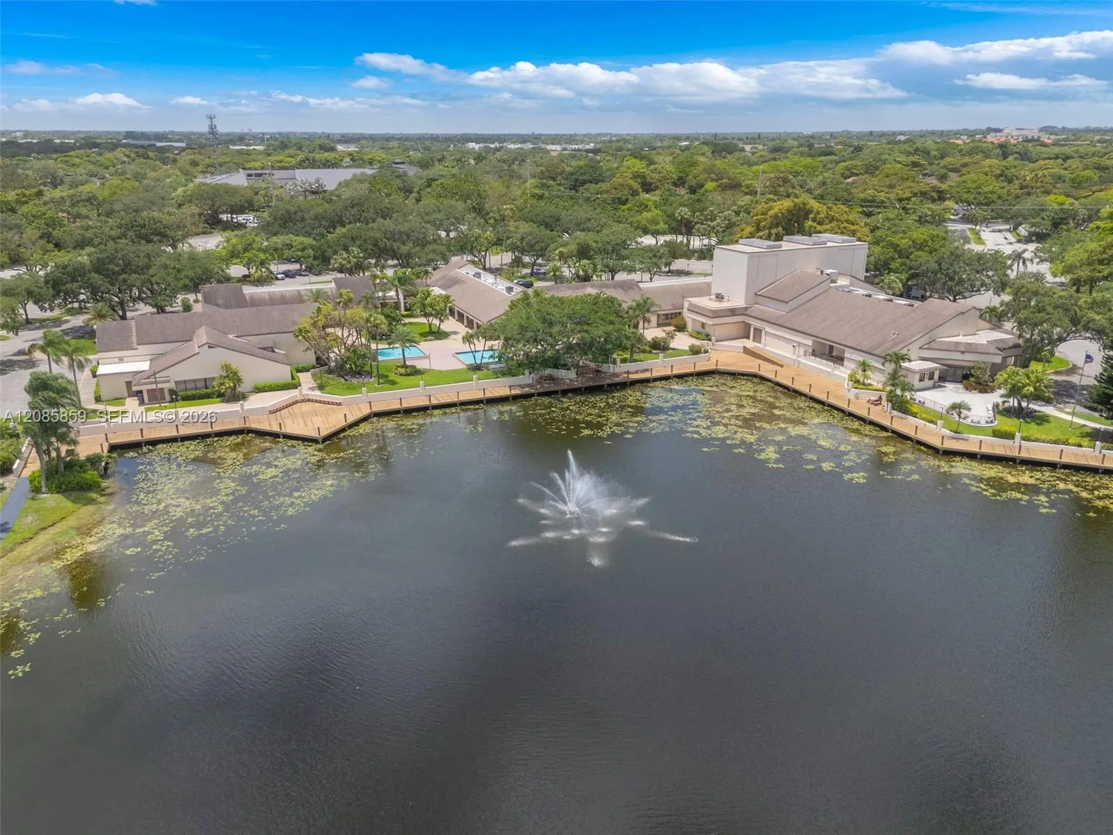 Stunning aerial view showcasing the community’s beautiful waterfront setting and beautiful surrounding greenery