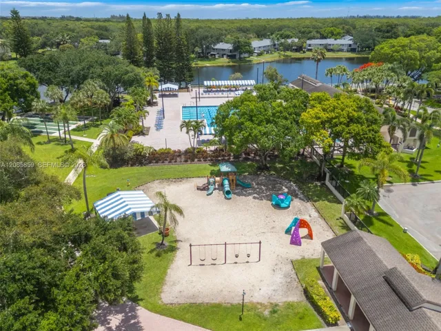 Aerial view highlighting the community’s lush grounds, recreational amenities, and waterfront setting.
