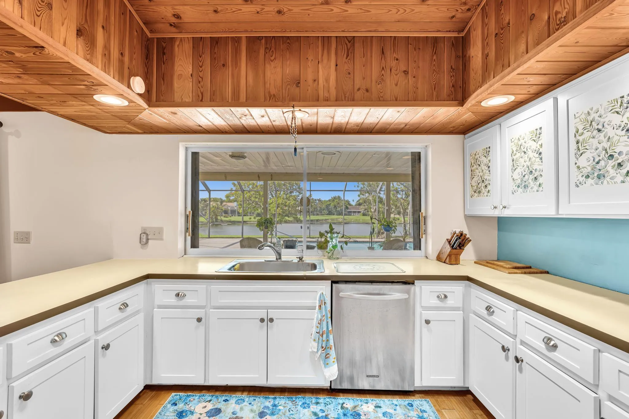 Kitchen window overlooks pool/lake