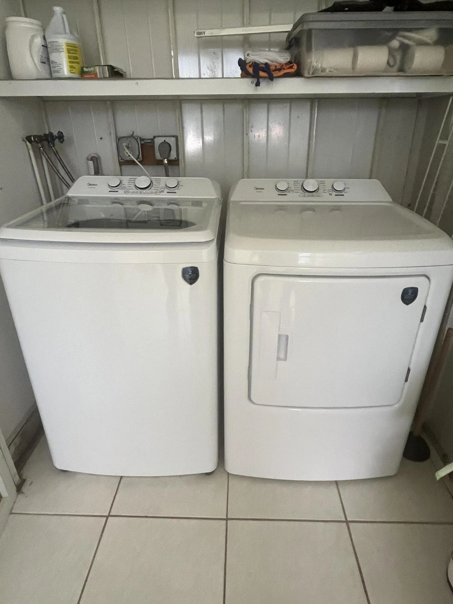full sized side by side washer/dryer on the patio in the utility closet.