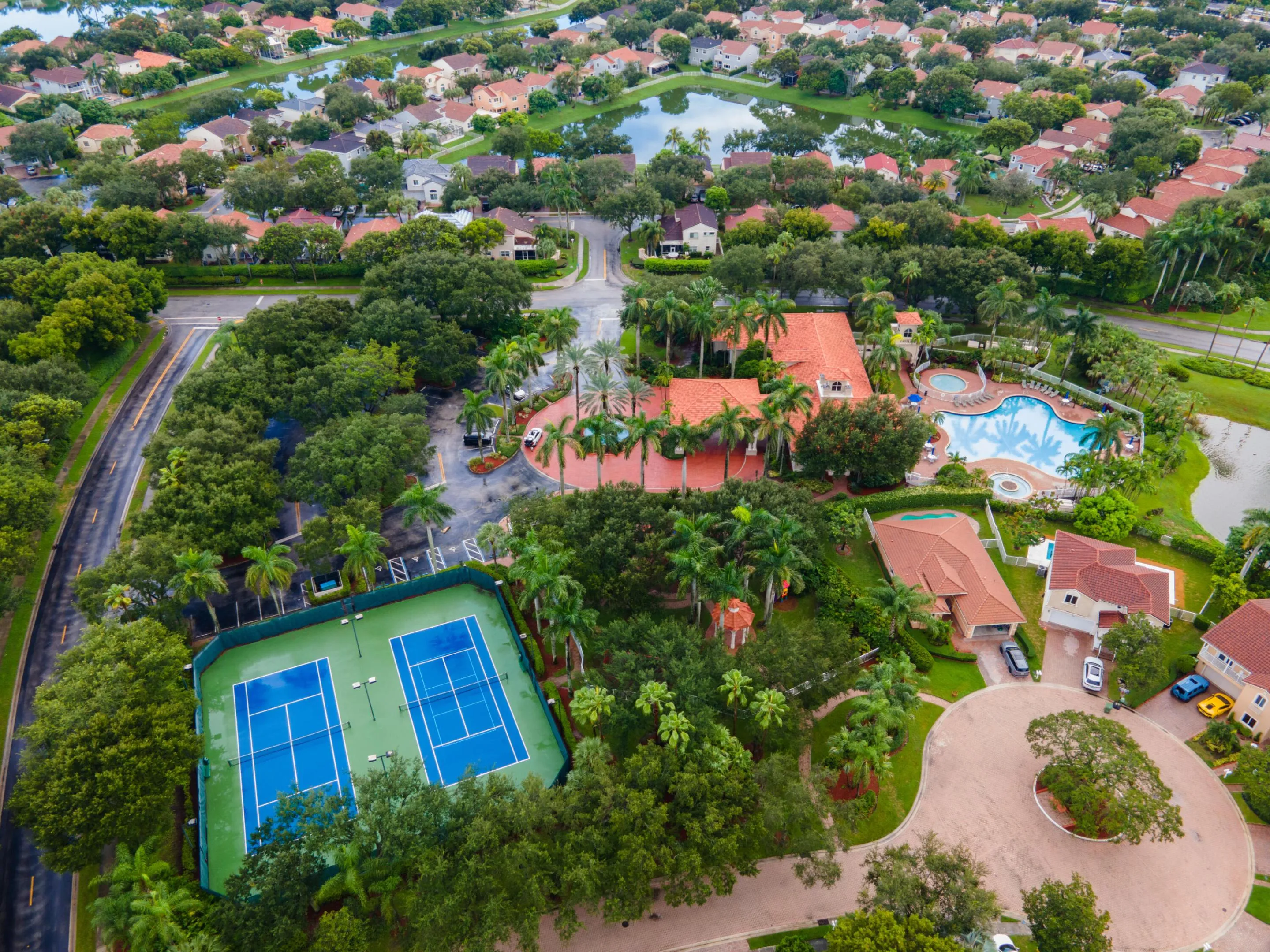 Clubhouse aerial including tennis court and pool