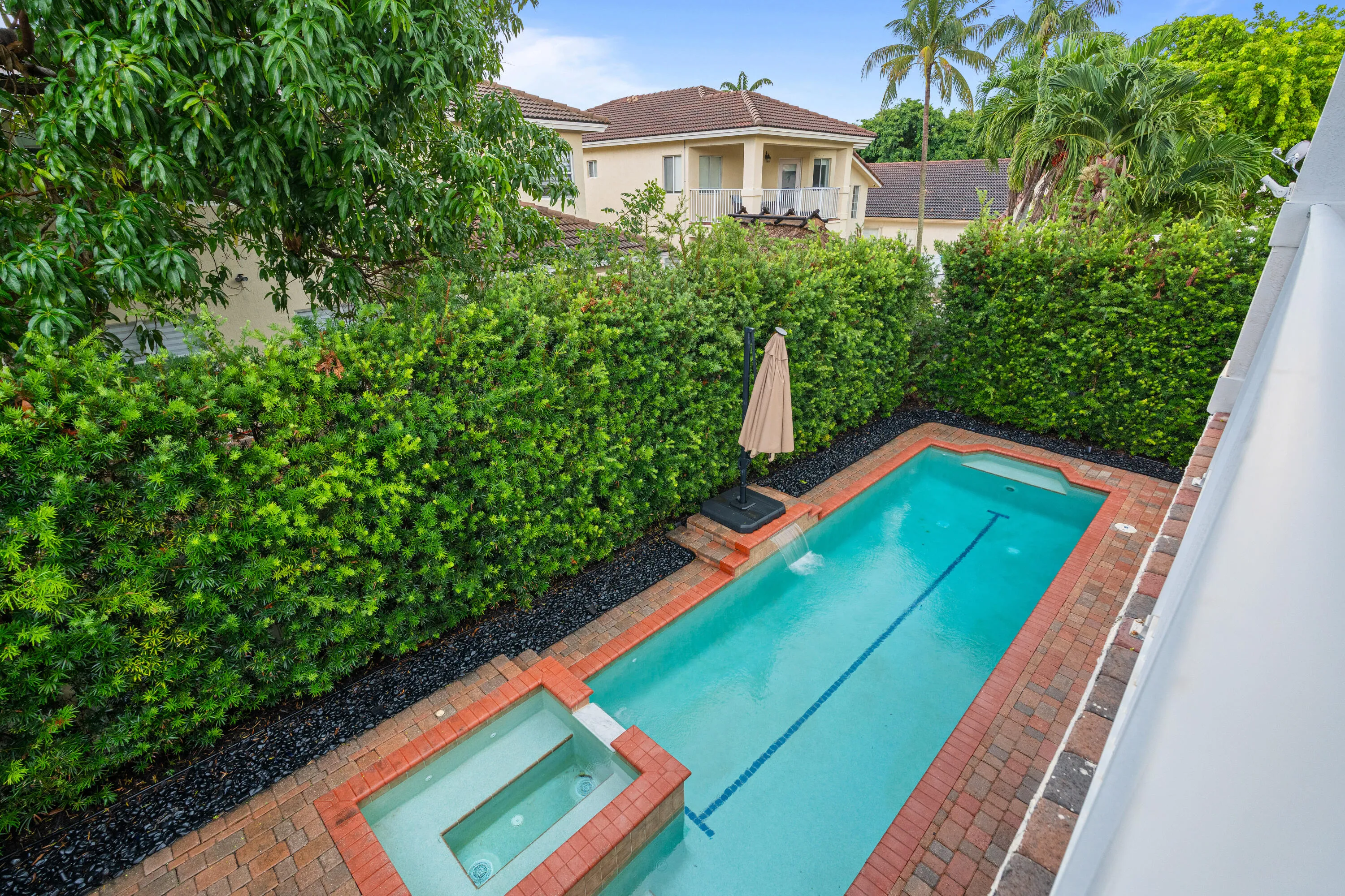 Balcony view down to pool off master bedroom