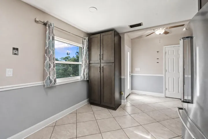View from inside the kitchen facing front entry. Window overlooks front yard.