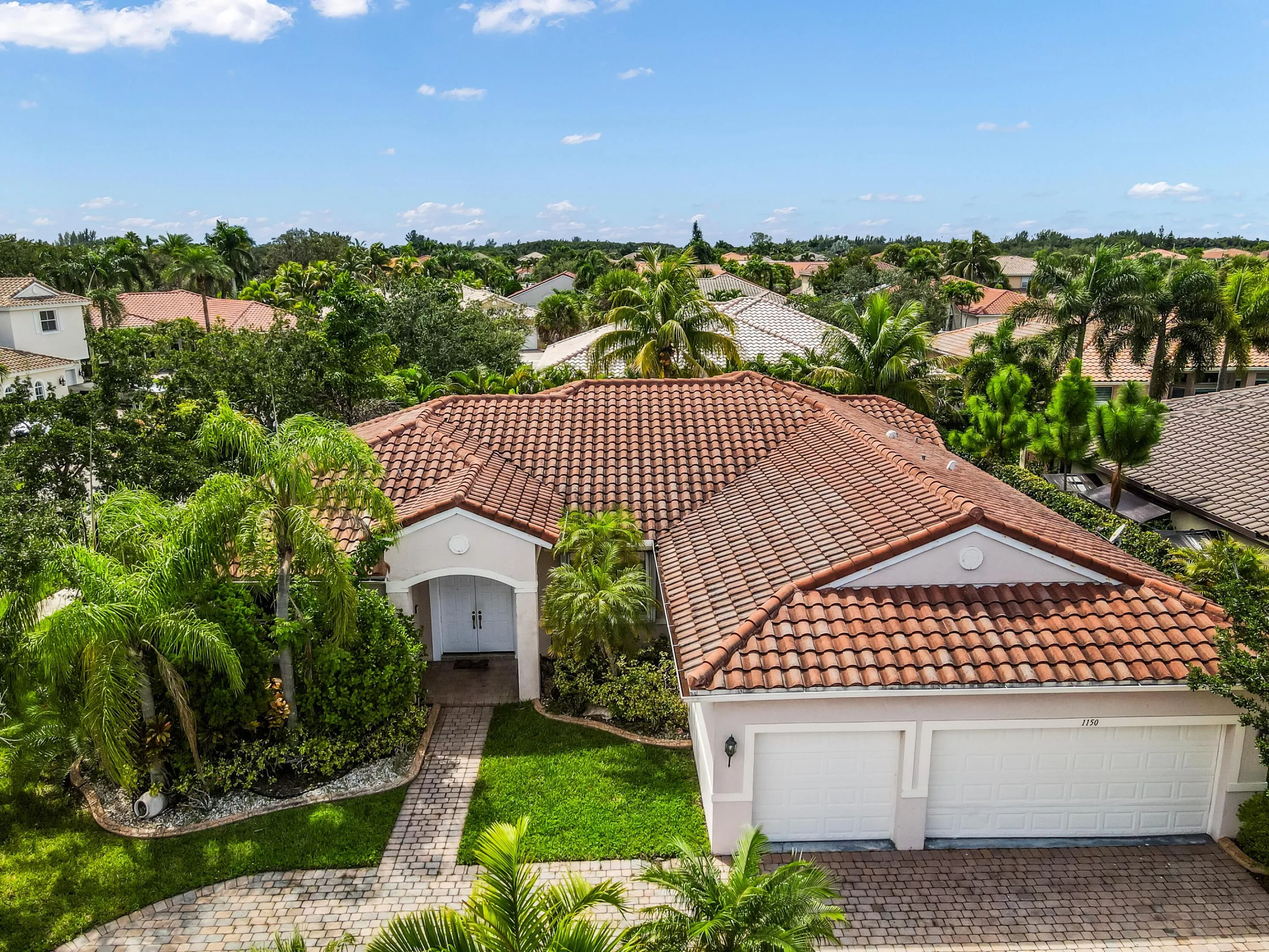 Mediterranean-style architecture with a tile roof and stucco exterior