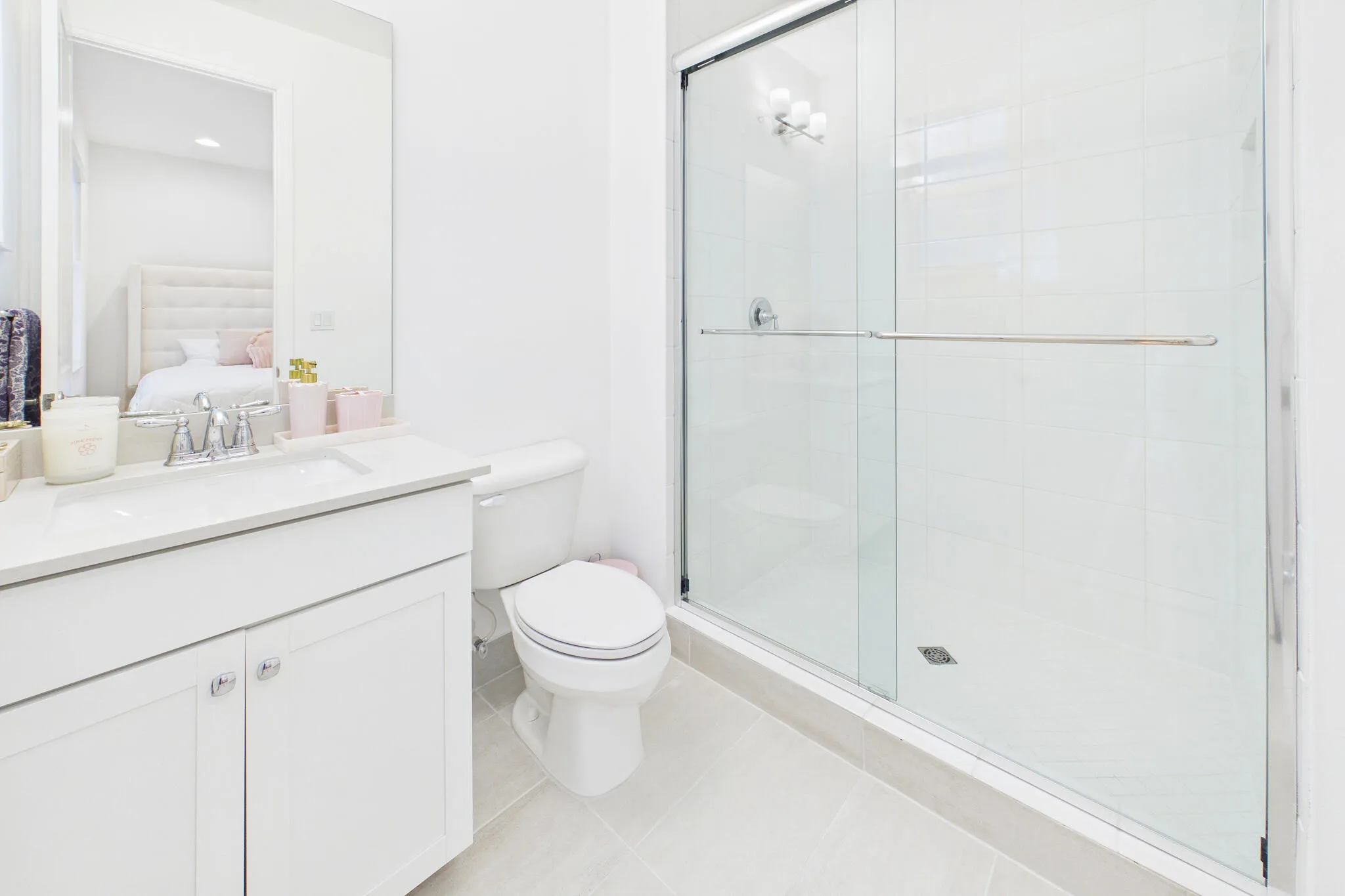 Vanity with integrated sink, chrome faucet, and cabinet storage